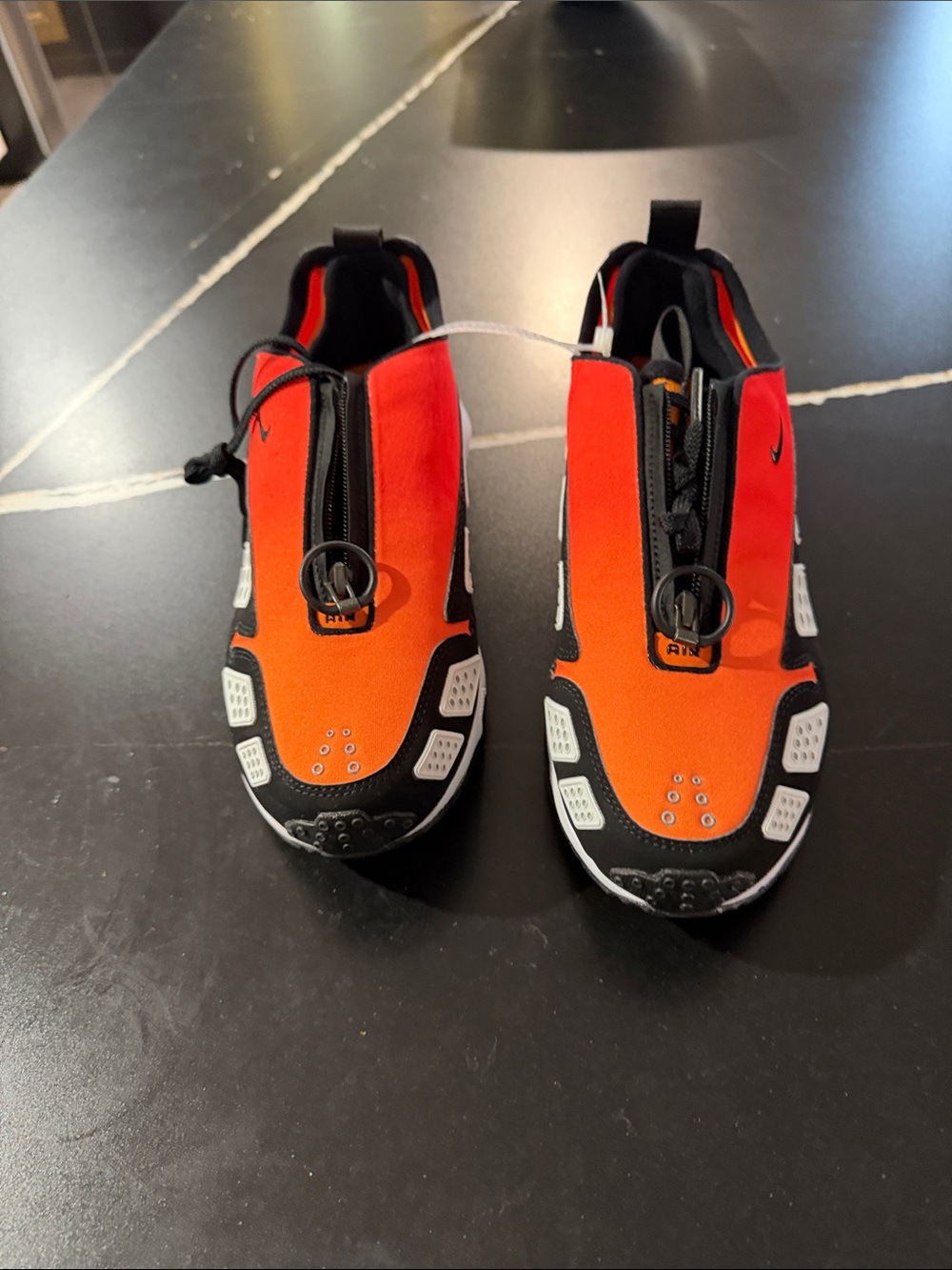 Nike Slip-On Running Shoes in Orange, Black & White